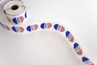 A scroll of stickers that say “I voted”