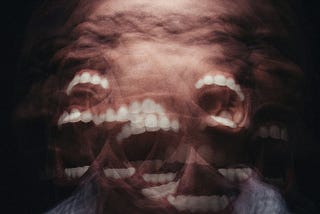 Multi-exposure of man shaking his head, screaming