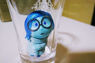 sadness from the pixar film inside out looks at the camera sadly