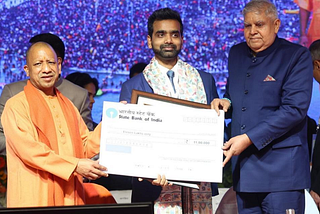 ClimateAi CEO Himanshu Gupta receiving the UP Gaurav Samman award from Chief Minister Yogi Adityanath and the Vice President of India, Jagdeep Dhankhar.
