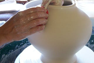 How is a handmade ceramic cremation urn made?