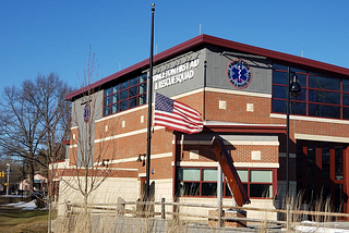 An American flag flies at half-staff outside of the Princeton First Aid & Rescue Squad Building, in memory of the 500,000 Americans who have died since the start of the COVID-19 pandemic.