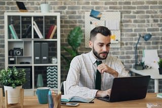 A guy working in the office.