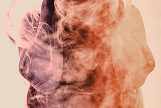 AN abstract art of warm coloured smoke in the form of crouched human
