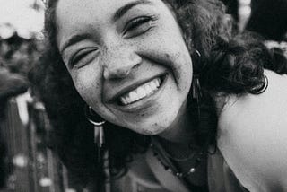 black and white photo of a girl smiling