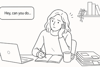 A woman working at a desk with a speech bubble from someone off screen saying “Hey, can you do…”