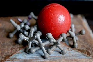 Jacks — red ball and tacks (childhood toy in 1970's)