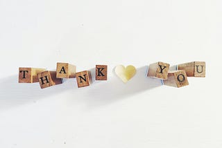 Wooden blocks spelling “Thank you”