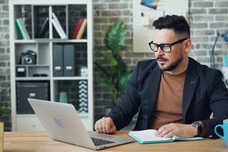 A gentleman working on his laptop