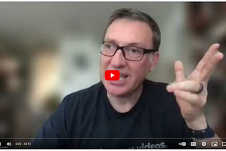 A rather unflattering image of me from the YouTube video, as automatically picked by YouTube’s algorithm. My hand is up as I sorta point with two fingers.