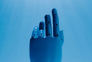 Blue robot hand reaching for a light source.