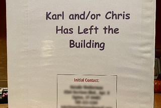 A photo of the cover of a three-ring binder titled “Karl and/or Chris Has Left the Building.”