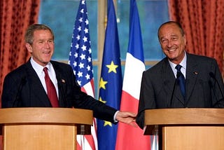 A friendly image on a podium with President Bush and President Chirac