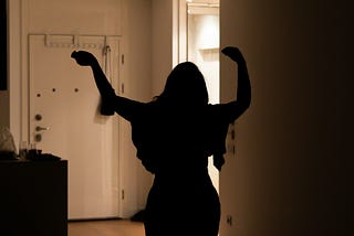 Woman dancing at home