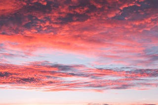 red blue and orange streaks cover the sky during a vivid sunset