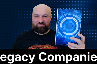 “Legacy Companies” cover with Accessible.org founder Kris Rivenburgh holding up his new book.