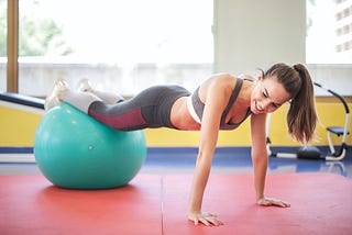 Photo Of Woman Wearing Grey Sports Bra