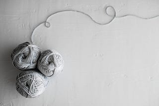 Photo of three balls of yarn… cuz ya know, this post will be talking about yarn.