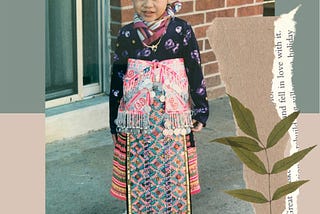 Toddler Sunshine sporting a very heavy traditional Hmong attire.