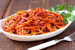 Spaghetti Amatriciana Style With Dry Italian Sausage.