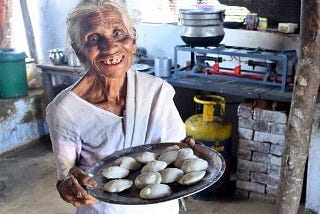 Idli Amma serving poor