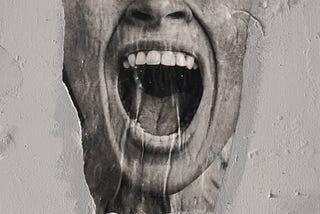 Grey scale photograph of a screaming mouth dripping slimy liquid, the upper half of the face and the rest of the head covered or perhaps buried in concrete.