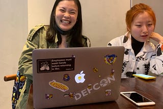 Image showing a reporter with a Defcon Sticker at the China 1.0 press conference.