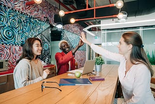 Diversity of women in consulting. Photo by Alexander Suhorucov: https://www.pexels.com/photo/happy-diverse-female-coworkers-giving-high-five-after-successful-deal-6457610/