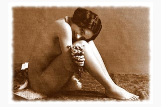 Vintage picture of a naked young woman holding a bunch of flowers