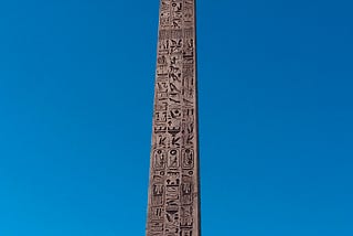 An obelisk with ancient Egyptian hieroglyphs.