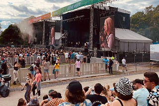 The band Men I Trust performing at Osheaga under a cloudy sky.