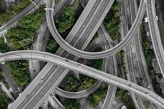 aerial photo of gray concrete top roads Photo by _M_V_ on Unsplash