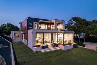 Zbranek_Holt_LakeLBJ_Modern_Luxury_Lakehouse_Elevated_View_Glass_Walls_Terrace_Seating