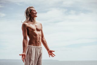 A lean model on a beach.