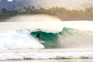 Surfing in Mentawai. Photo by James Donaldson on Unsplash.
