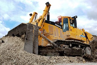 A bulldozer leveling ground