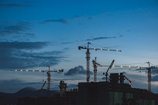 Photo of construction, blue sky, malaysia and kuala lumpur in Kuala Lumpur, Malaysia by EJ Yao