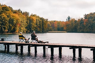 Two Men Fishing on Lake