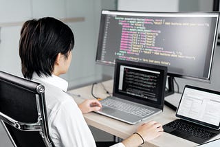 Photo by Mikhail Nilov: https://www.pexels.com/photo/a-man-sitting-in-front-of-the-computer-while-working-7988087/