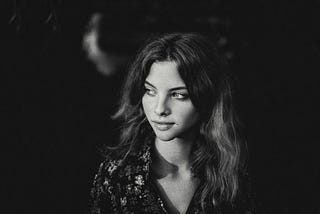 A black and white photo of woman with long hair