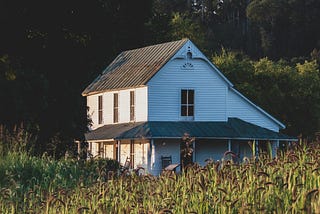 Antique farmhouse on the edge of the woods