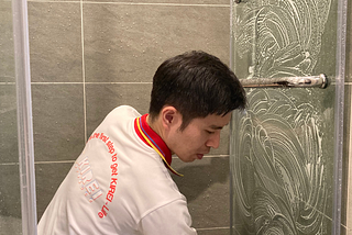Man cleaning the bathroom