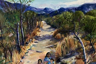 Mother with baby in arms andchild are walking through desert