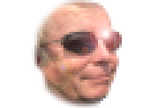 A pixellated image of the author’s smirk-smile  in sunglasses with a highlight on one of the lenses.