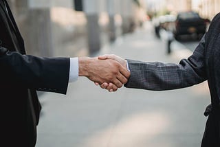 Two men shaking hands.