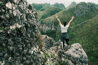 Woman climbing a mountain