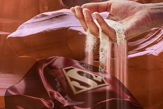 sands of time flowing to bury the superwoman cape
