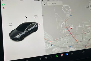 A photo of the center display in a Telsa Model 3 with the author’s prototype displayed