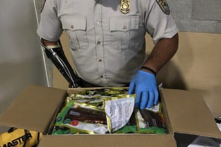 An official sorts through items in a package