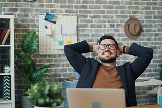 A guy daydreaming in the office.